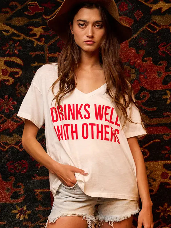 DRINKS WELL WITH OTHERS Graphic T-shirt Top